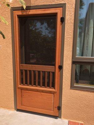 Spanish Cedar screen door, raised panel and latilla detail.