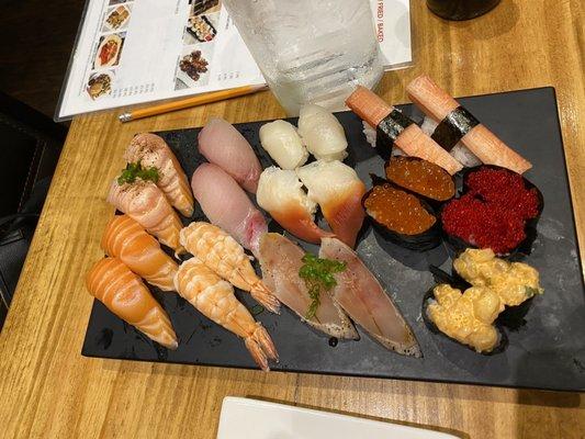 seared salmon, salmon, hamachi, shrimp, scallop, surf clam, albacore, crab, ikura, flying fish roe, & spicy scallop