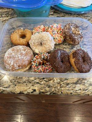 lemon jelly donut bursting with goodness. Coconut, old fashioned, chocolate glazed, and a variety of festive sprinkled donuts.