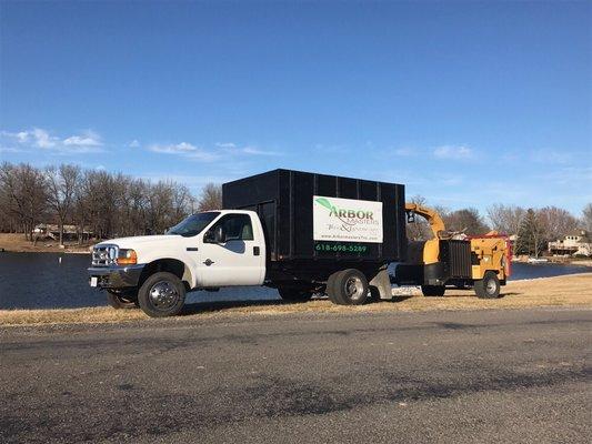 Brush chipper, dump truck