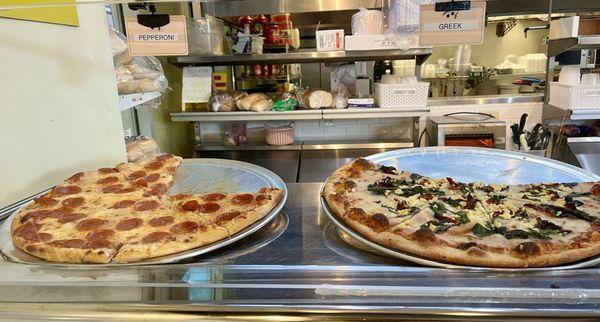 Pizzas by the slice on display