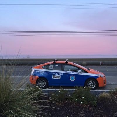 Hybrid Cab # 111 in Davis CA along Poleline Road at sunset.