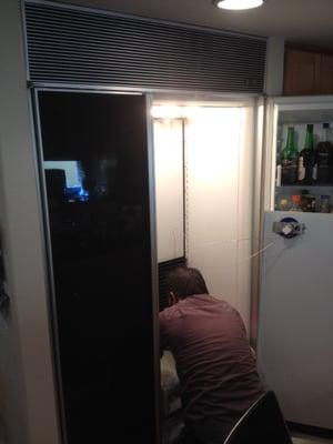 Boris performing a repair on Sub Zero refrigerator in the city of Manhattan Beach