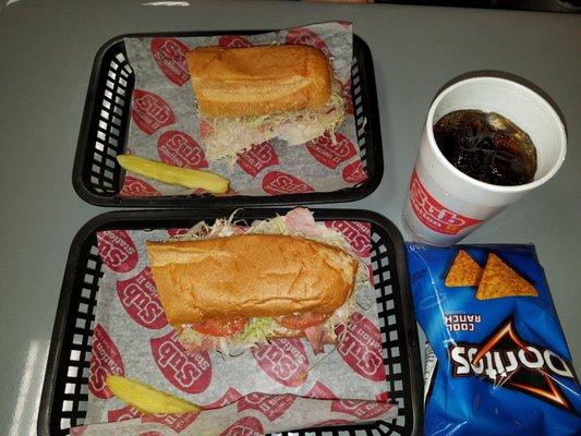 The ultimate sub with chips and a drink