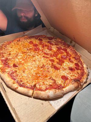 1/2 pepperoni & pineapple, 1/2 cheese & pineapple - notice the size of the pizza compared to my 20-year-old son's head!