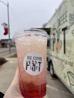 Lotus drink in front of The Coffee Pot trailer.