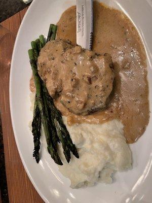 Fillet mignon with a peppercorn brandy cream sauce. Grilled asparagus and mashed potatoes.