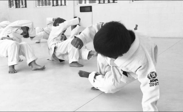 Kids learn movement and practical self-defense techniques.