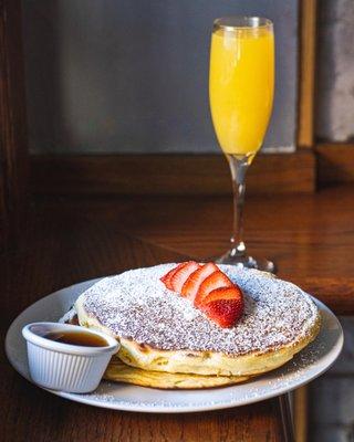 Bottomless brunch. Pancakes and mimosas