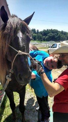 Michael loves his hippotherapy session with Zachery.