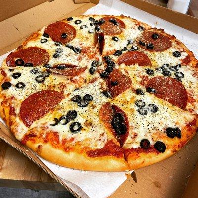 Pizza with pepperoni and olives