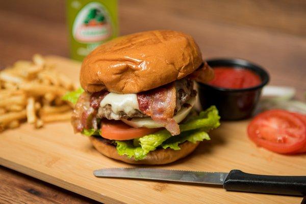 El Primo Famous Burger Combo 
 Onions, cheese, bacon, lettuce, pickles, dressing,
 and tomato served with french fries.