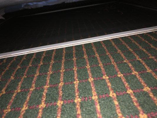 Window screen under the bed.