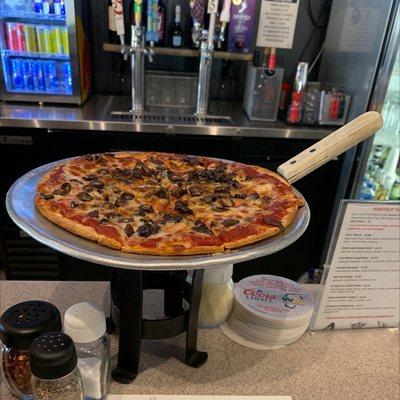 Thin crust 10' kalamata olive pizza.