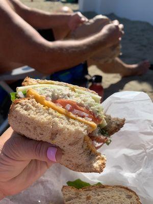 Albacore tuna sandwich on honey wheat bread, no Mayo on bread.  Take it to the beach and eat or to the fairy on your way home.