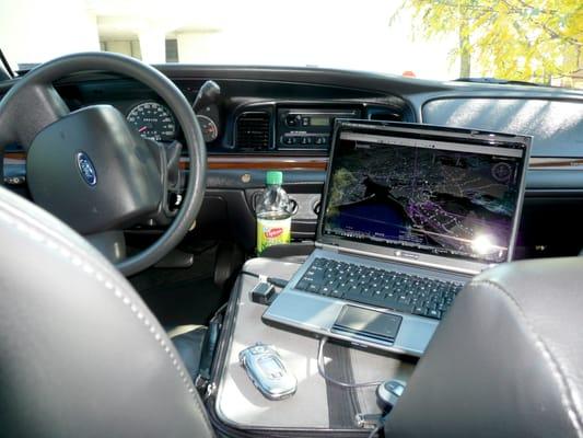 Early Days...Crown Victoria w/laptop standing by JFK tracking flights