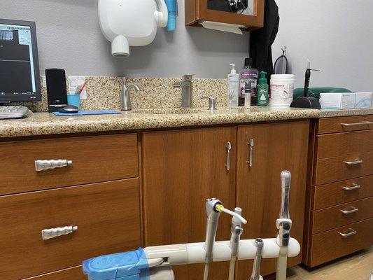 The quirky toothpaste & toothbrush pulls on the cabinets in each patient room. So fun!