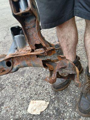 Rotted subframe. Crooked car stealership