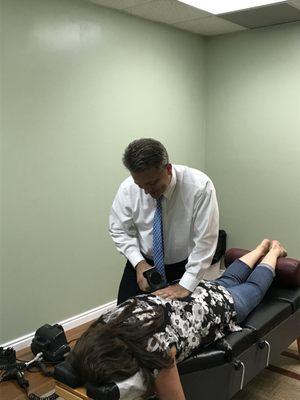 Dr. Annis helping a patient