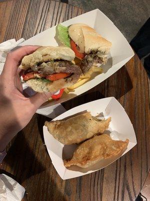 Steak sandwich and empanadas