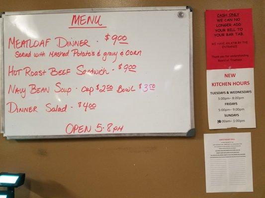 Kitchen menu, hours and cash only rule.