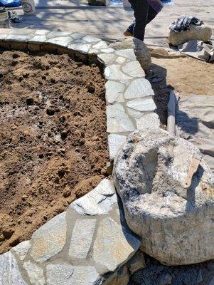 Flagstone retaining wall.