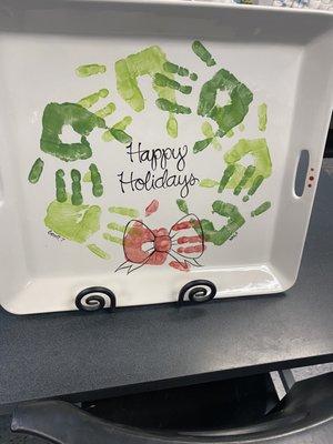 Handprints in the shape of a wreath... with a bow.... And just a simple happy holidays