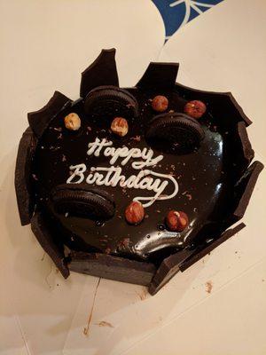 An absolutely aces birthday gelato cake: dark chocolate and roasted almond gelato, chocolate hazelnut filling, and vanilla cake.