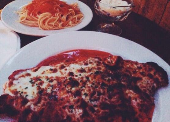 Chicken parm and pasta with tomato sauce , best parm in queens