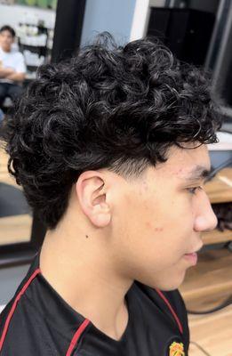 Men's (Curly) cut, with tapered side burns. Trimmed up the curls w/ wash and style to hydrate curls