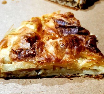 Cheese Burek. Like a cross between a croissant and a pizza. Crispy, flaky crust. Soft & doughy inside with some melted  cheese. Fantastic