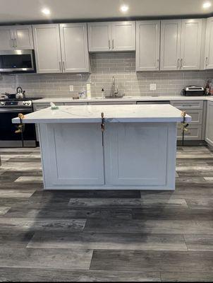 picture of our kitchen island when it was just completed; clamps holding it together while the adhesive cures