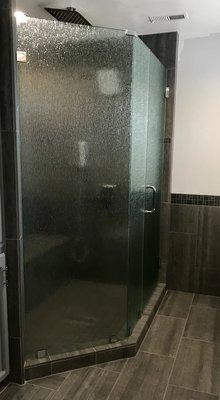 3/8" clear rain glass frameless shower enclosure.