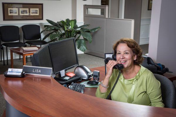 Lisa Sherman cheerfully greats guests in person and over the phone.