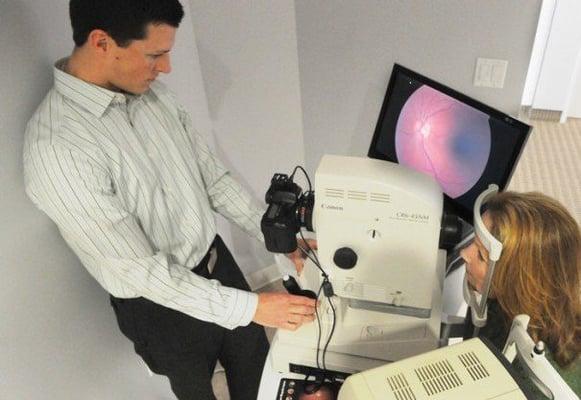 Dr. Batey using the retinal camera. It's used to monitor diabetic, hypertensive, and macular degeneration changes inside the eye