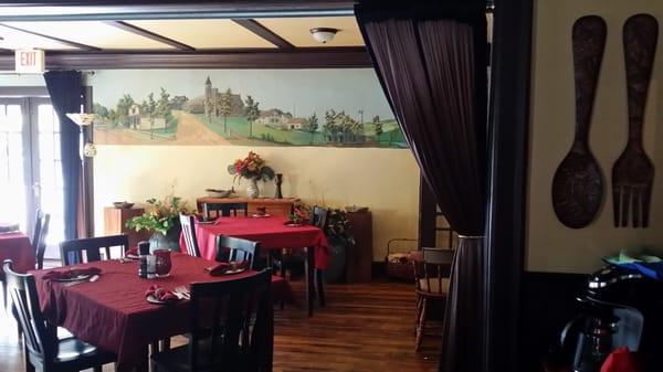 The other side of restaurant decorated by the beautiful mural by Frank Eckmair. We miss him dearly.