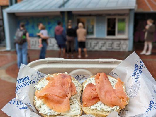 A lox and shmear sandwich on an everything bagel