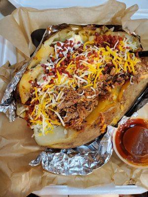 Stuffed Baked Potato with chopped beef, cheese, sour cream and cheese.