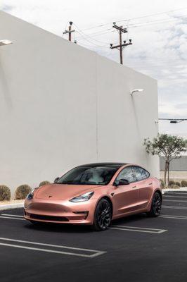 Tesla Model 3 Project. Wrapped in Satin Rose Gold with interior Trims wrapped to match, Tinted and ceramic coated.