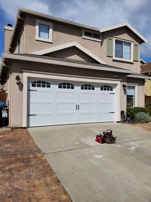 Old one piece wood door take out installed carrage stamp 
Steal back with nice windows.