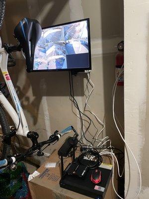 Security camera dvr setup in garage! Placed on a moving box.