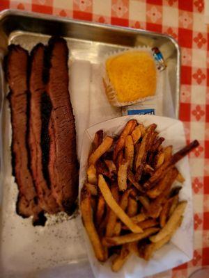 Brisket, corn bread and fries.