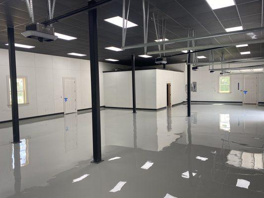 Sliver Epoxy Floors by 33 DreamCrete. This application is for a five garage for classic cars.