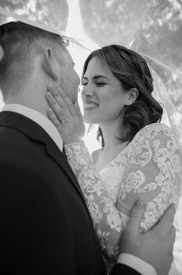 Black and white photo of happy bride and groom closeup