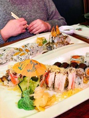 Sweet potato roll, shrimp tempura roll, salmon roll and spicy tuna roll.