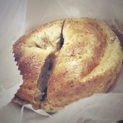 Fresh toasted whole wheat bagel and butter