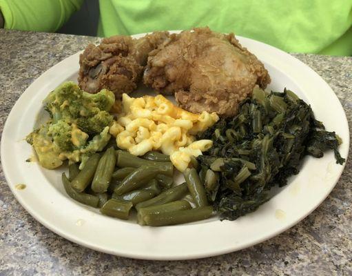 Fried chicken, greens, broccoli casserole, green beans and macaroni and cheese.