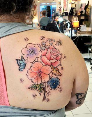 Floral tattoo by artist Sarah Mooney