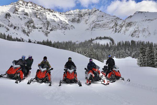 Our five sleds with the beauty of the San Juan mountains in the background.