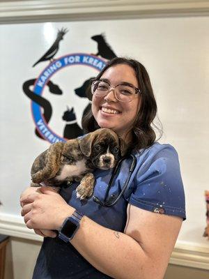 Vet Tech student Hannah grabbing some puppy hugs.